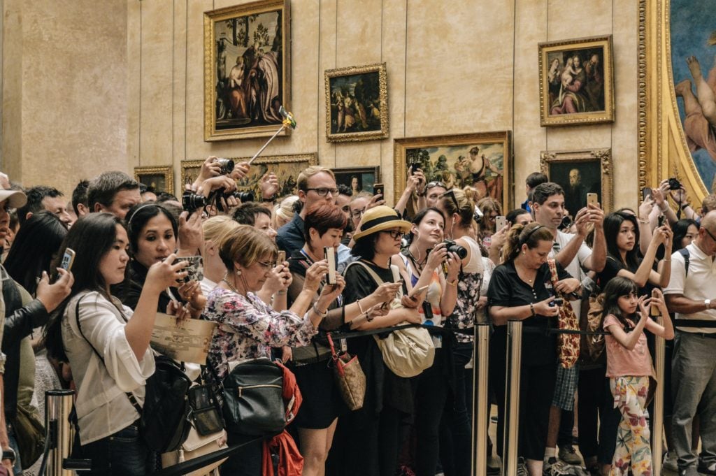 Tourists in line for Mona Lisa, Louvre, Paris, France